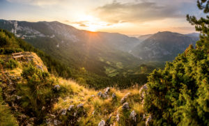 A break bench stands in the evening sun over the mountain range over the canyon of the river Tara, Zabljak, Durmitor National Park, Montenegro. A break bench stands in the evening sun over the mountain range over the canyon of the river Tara, Zabljak, Durmitor National Park, Montenegro.