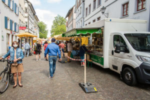 People wear face masks due to the corona pandemic on a market day in downtown Leutkirch, Baden-Württemberg, Germany People wear face masks due to the corona pandemic on a market day in downtown Leutkirch, Baden-Württemberg, Germany