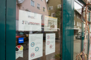Due to the corona pandemic, restrictions on passenger traffic in the city center of Leutkirch are displayed on a shop door, Baden-Württemberg, Germany Due to the corona pandemic, restrictions on passenger traffic in the city center of Leutkirch are displayed on a shop door, Baden-Württemberg, Germany