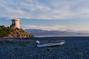 The Genoa Tower on Marine d'Albo beach near Ogliastro at sunset, Corsica, France The Genoa Tower on Marine d'Albo beach near Ogliastro at sunset, Corsica, France