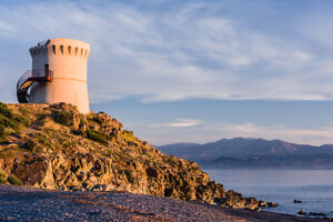 The Genoa Tower on Marine d'Albo beach near Ogliastro at sunset, Corsica, France The Genoa Tower on Marine d'Albo beach near Ogliastro at sunset, Corsica, France