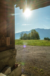View from a barn against the sun in Switzerland. Buchs, St. Gallen, Switzerland View from a barn against the sun in Switzerland. Buchs, St. Gallen, Switzerland
