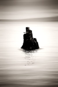 With ropes and dews corded wood trunks standing out of the water, With ropes and dews corded wood trunks standing out of the water,