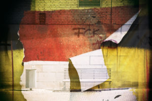 Abstract montage of a park bench in front of a wall scribbled with political slogans with ripped off scraps of paper, Abstract montage of a park bench in front of a wall scribbled with political slogans with ripped off scraps of paper,