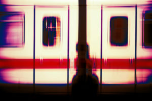 Abstractly blurred bodywork of a passenger train with two windows and doors, Abstractly blurred bodywork of a passenger train with two windows and doors,