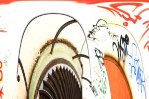 The montage of twisted stairs with railing and a colourfully scribbled wall, The montage of twisted stairs with railing and a colourfully scribbled wall,