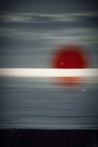 Silhouette of a jogger on the beach, in the evening, solar reflexions in the water, blur Silhouette of a jogger on the beach, in the evening, solar reflexions in the water, blur