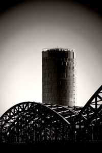 The modern high rise KölnTriangle / LVR Turm (tower) behind it the arches of the Hohenzollernbrücke The modern high rise KölnTriangle / LVR Turm (tower) behind it the arches of the Hohenzollernbrücke