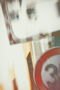The abstract double exposure of a confusing junction corner with a traffic mirror and a speed limitation. The abstract double exposure of a confusing junction corner with a traffic mirror and a speed limitation.