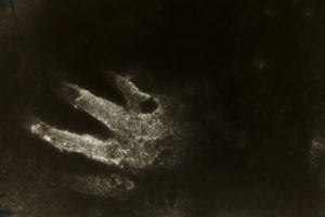 Handprint in a dusting of snow, digitally manipulated Handprint in a dusting of snow, digitally manipulated
