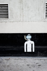 Picture of a diver on a house wall in the city