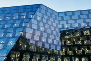modern building, facade, glass, metal, windows, lighted, sky, dusk