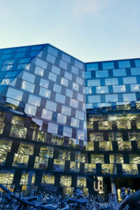 modern building, facade, glass, metal, windows, lighted, sky, dusk