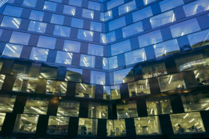 modern building, facade, glass, metal, windows, lighted, sky, dusk