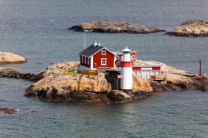 Sweden, small archipelago island with house and lighthouse between Fedjefjord and Fensfjord Sweden, small archipelago island with house and lighthouse between Fedjefjord and Fensfjord