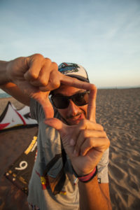 Lifestyle, urban scene, male, young, men, sunglasses, cap, T-shirt, Generation Y cool looking, feel good, lifestyle, beach, trendy, kite surf on beach, funny Lifestyle, urban scene, male, young, men, sunglasses, cap, T-shirt, Generation Y cool looking, feel good, lifestyle, beach, trendy, kite surf on beach, funny