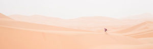 young woman, backpacker on lonely dune, Morocco, Merzouga young woman, backpacker on lonely dune, Morocco, Merzouga