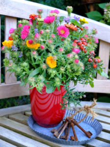 Autumnal bouquet with asters, calendula, zinnias and rose hip Autumnal bouquet with asters, calendula, zinnias and rose hip