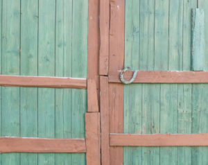 Green barn door with horseshoe Green barn door with horseshoe