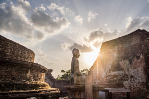 Buddha statue in sunset in a ruin of Sri Lanka's old capital, Polonnaruwa Buddha statue in sunset in a ruin of Sri Lanka's old capital, Polonnaruwa