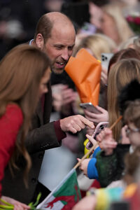 The Prince and Princess of Wales greet well wishers during a visit to Pontypridd Market in Wales to talk to local business owners about the impact of the flooding caused by Storm Bert and Storm Darragh, and help prepare and cook a batch of Welsh cakes at the The Welsh Cake Shop.