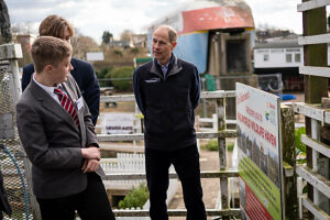 The Duke of Edinburgh talks to students Lucas Tuck and Michael Perkins who completed their volunteering section at Railworld last year during a visit to Railworld Wildlife Haven in Peterborough, Cambridgeshire.