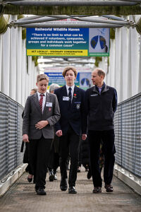 The Duke of Edinburgh talks to students Lucas Tuck and Michael Perkins who completed their volunteering section at Railworld last year during a visit to Railworld Wildlife Haven in Peterborough, Cambridgeshire.