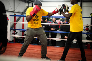 The Duke of Edinburgh watches people sparring during a visit to Boxing Futures in Peterborough, Cambridgeshire.