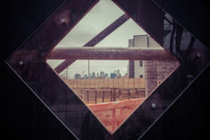 Construction site window with New York Skyline in Williamsburg, City Planning, Brooklyn, USA Construction site window with New York Skyline in Williamsburg, City Planning, Brooklyn, USA