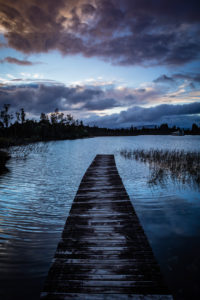 Evening mood and boardwalk on Lake Brunner, South Island New Zealand Evening mood and boardwalk on Lake Brunner, South Island New Zealand