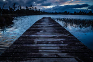 Evening mood and boardwalk on Lake Brunner, South Island New Zealand Evening mood and boardwalk on Lake Brunner, South Island New Zealand