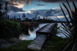 Evening mood and boardwalk on Lake Brunner, South Island New Zealand Evening mood and boardwalk on Lake Brunner, South Island New Zealand