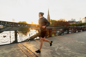 Sporty man jogging in the town, Frankfurt on the Main, Hessen, Germany Sporty man jogging in the town, Frankfurt on the Main, Hessen, Germany