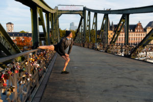 Sporty man stretching in the town, Frankfurt on the Main, Hessen, Germany Sporty man stretching in the town, Frankfurt on the Main, Hessen, Germany