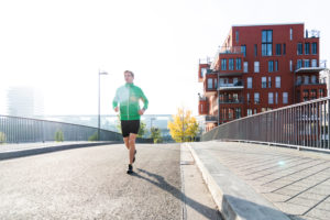 Sporty man jogging in the town, Frankfurt on the Main, Hessen, Sporty man jogging in the town, Frankfurt on the Main, Hessen,