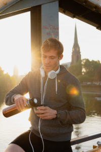 Sporty man has a break while jogging in the town, portrait Sporty man has a break while jogging in the town, portrait