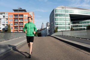Sporty man jogging in the town, Frankfurt on the Main, Hessen, Sporty man jogging in the town, Frankfurt on the Main, Hessen,