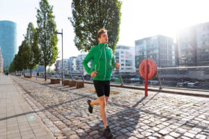 Sporty man jogging in the town, Frankfurt on the Main, Hessen, Sporty man jogging in the town, Frankfurt on the Main, Hessen,