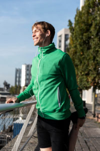 Sporty man jogging in the town, half portrait Sporty man jogging in the town, half portrait