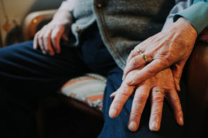 Hands old married couple with wedding ring