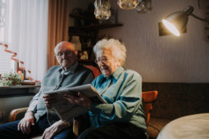 older couple, reading newspaper