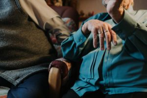 older couple, detail, woman with wedding ring