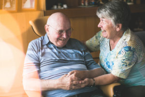 Laughing older couple in domestic environment