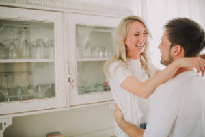 Young couple in love in the kitchen, profile