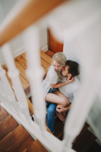 Young couple in love in the stairwell 