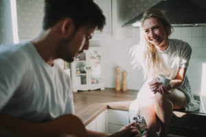 Young couple in love making music at home, half portrait