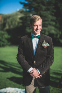 Bridegroom at wedding ceremony outside, half portrait