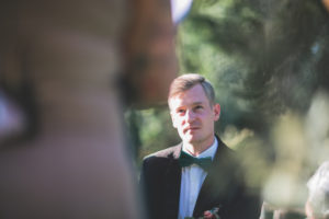 Bridegroom at wedding ceremony outside, portrait