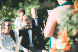 Alternate bridal couple at wedding ceremony outdoors, 