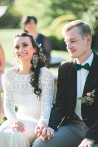 Alternate bridal couple at wedding ceremony outdoors